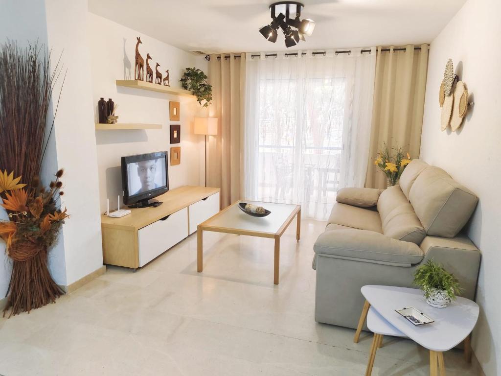 TV a/nebo společenská místnost v ubytování Vivienda en residencial con piscina