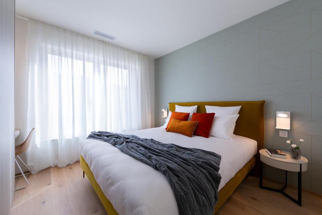 Postel nebo postele na pokoji v ubytování The Central City - Luxury Serviced Residence