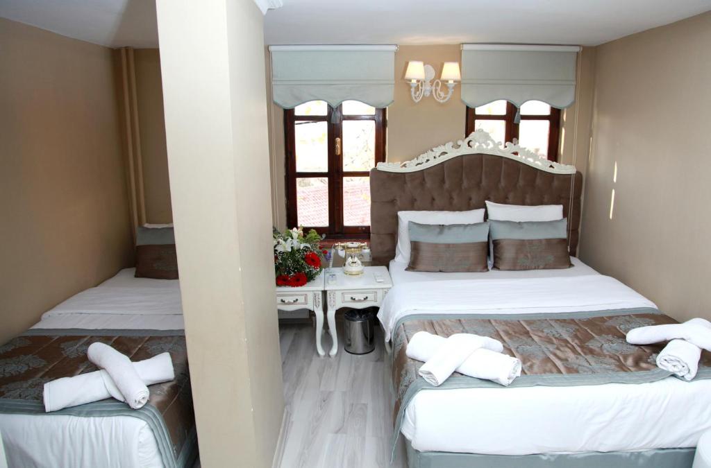 Postel nebo postele na pokoji v ubytování Kadi Konagi Thermal Hotel