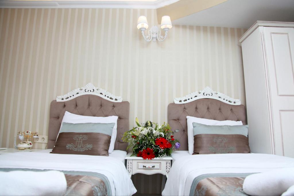 Postel nebo postele na pokoji v ubytování Kadi Konagi Thermal Hotel