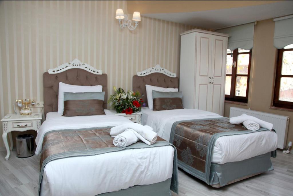 Postel nebo postele na pokoji v ubytování Kadi Konagi Thermal Hotel