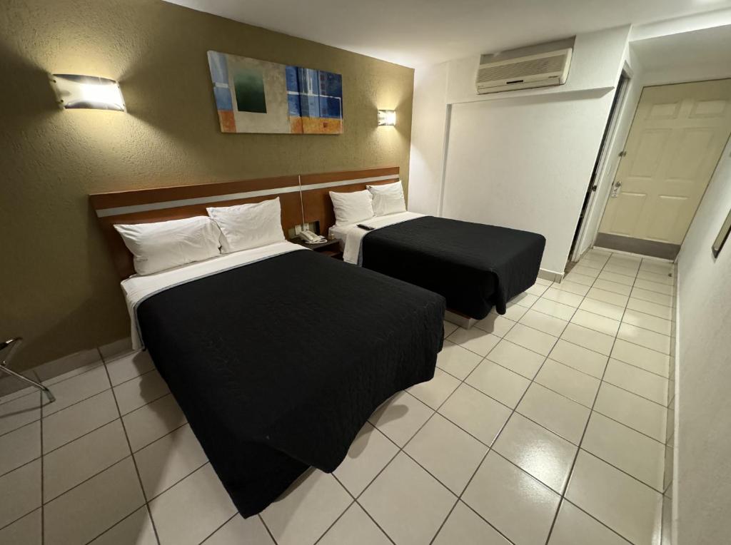 Postel nebo postele na pokoji v ubytování Hotel Interforum