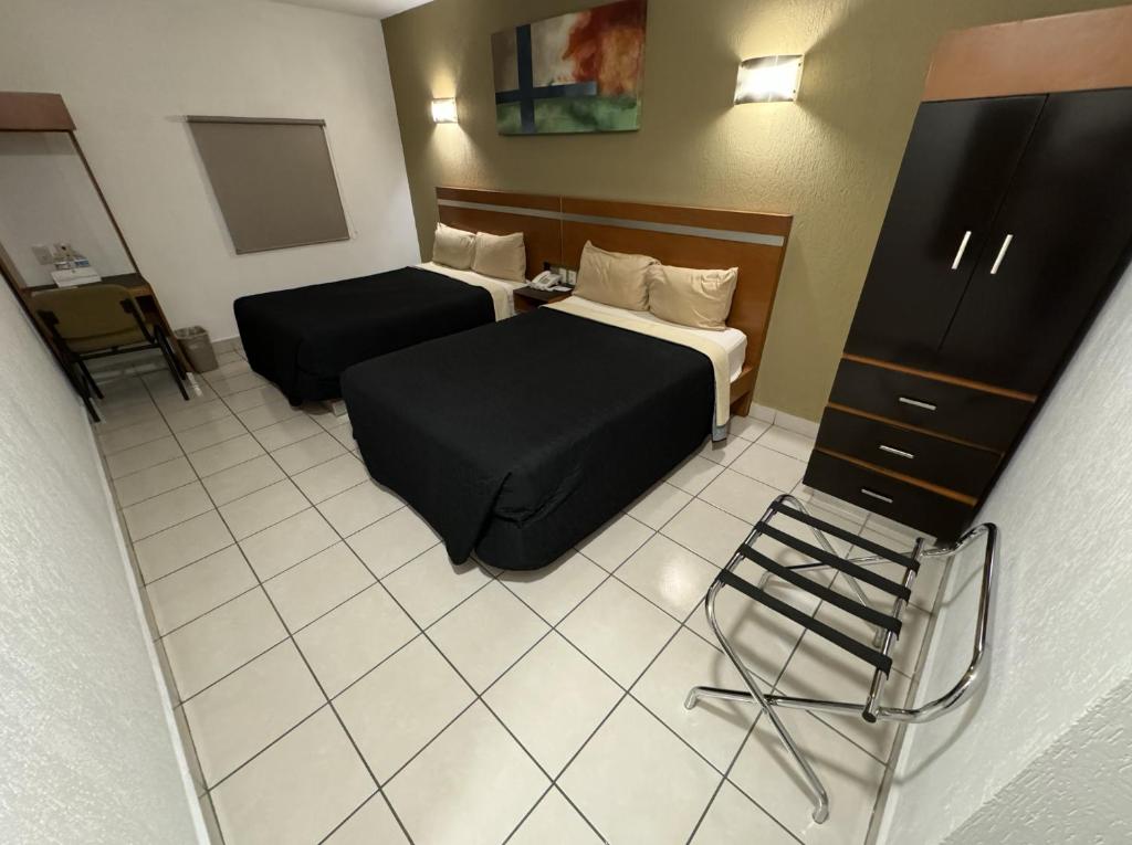Postel nebo postele na pokoji v ubytování Hotel Interforum