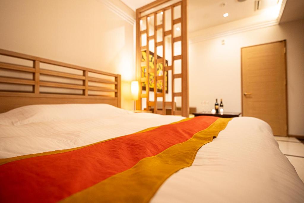 Postel nebo postele na pokoji v ubytování HOTEL LOTUS Superior RESORT NRT