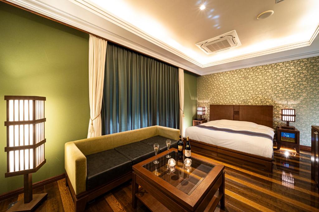 Postel nebo postele na pokoji v ubytování HOTEL LOTUS Superior RESORT NRT