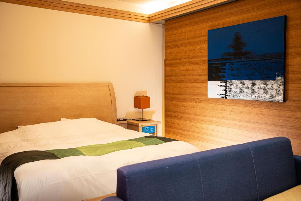 Postel nebo postele na pokoji v ubytování HOTEL LOTUS Superior RESORT NRT