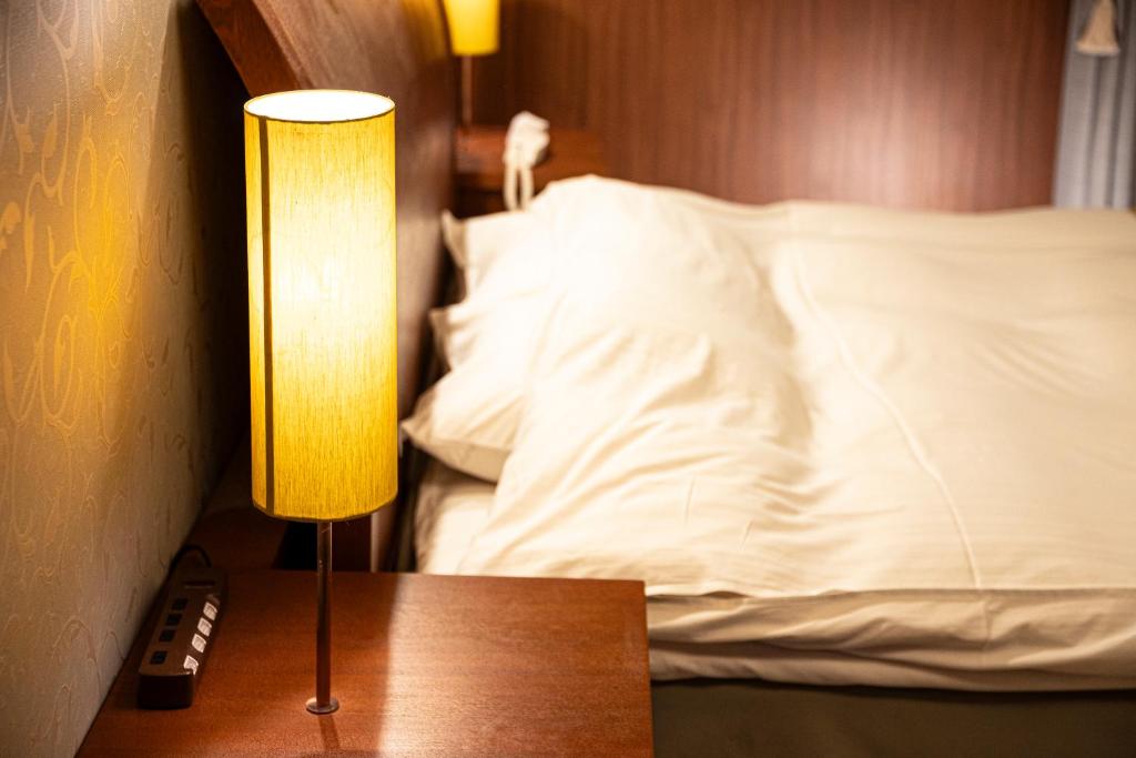 Postel nebo postele na pokoji v ubytování HOTEL LOTUS Superior RESORT NRT