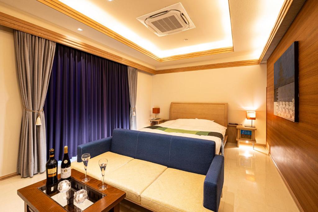 Postel nebo postele na pokoji v ubytování HOTEL LOTUS Superior RESORT NRT