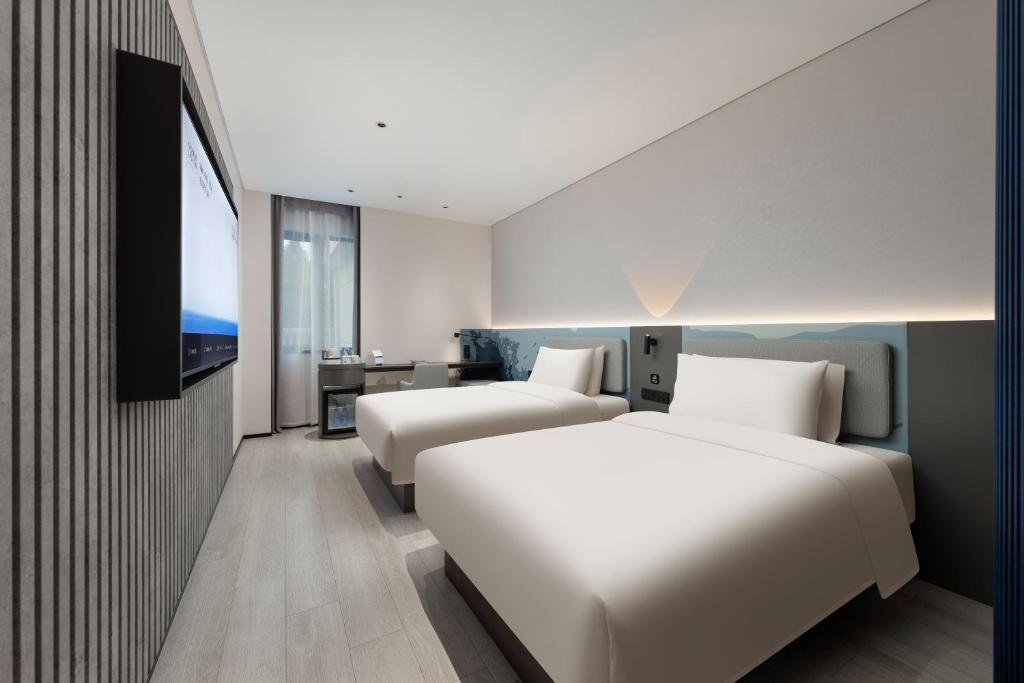 Postel nebo postele na pokoji v ubytování Atour Light Hotel Shanghai Jiading Pingcheng Road