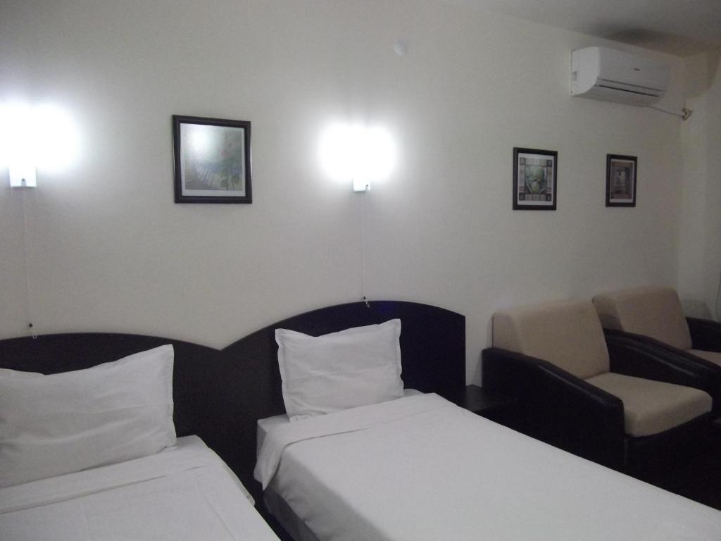 Postel nebo postele na pokoji v ubytování Hotel Enchevi