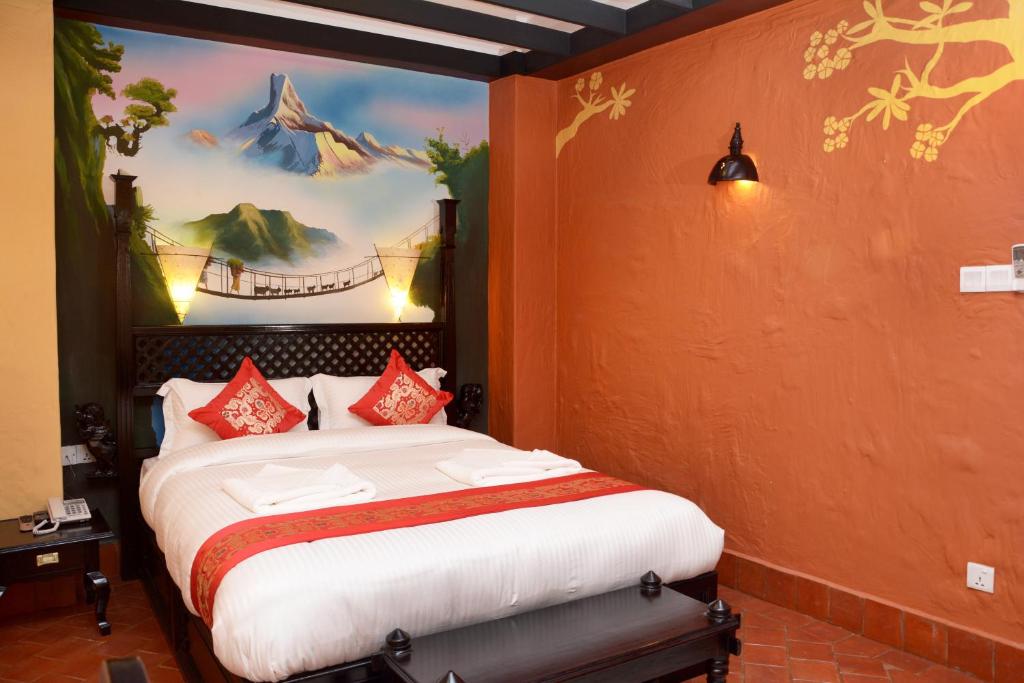 Postel nebo postele na pokoji v ubytování Kasthamandap Boutique Hotel