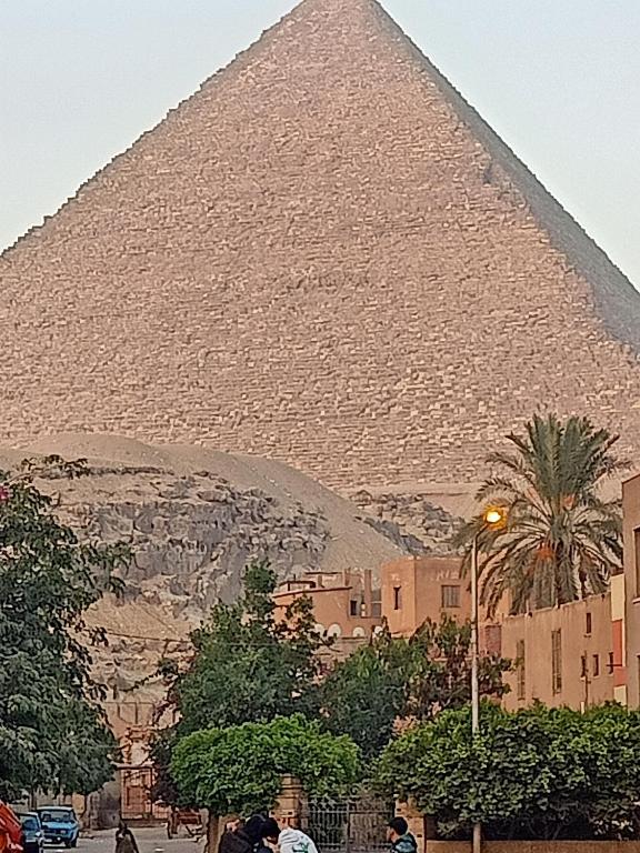 a view of the pyramid of giza in cairo at Big pyramid view house in Cairo