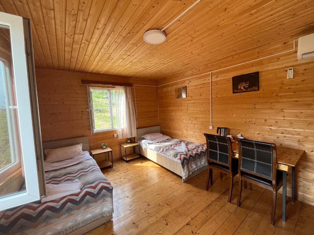 Postel nebo postele na pokoji v ubytování Teo's Cottages