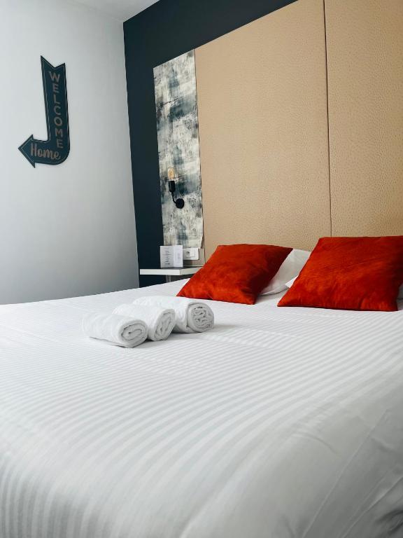 Postel nebo postele na pokoji v ubytování L'Hôtel Bristol