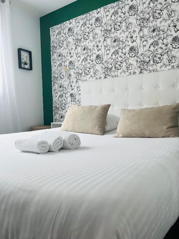 Postel nebo postele na pokoji v ubytování L'Hôtel Bristol