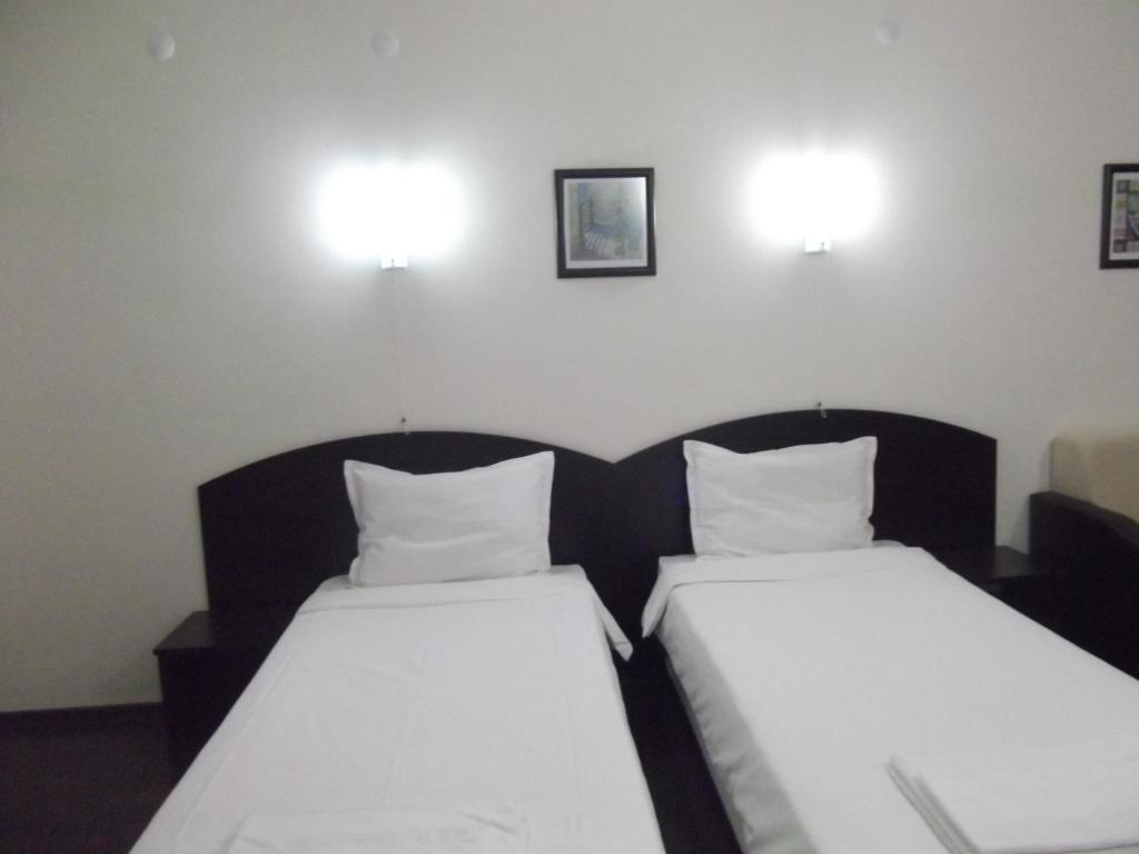 Postel nebo postele na pokoji v ubytování Hotel Enchevi