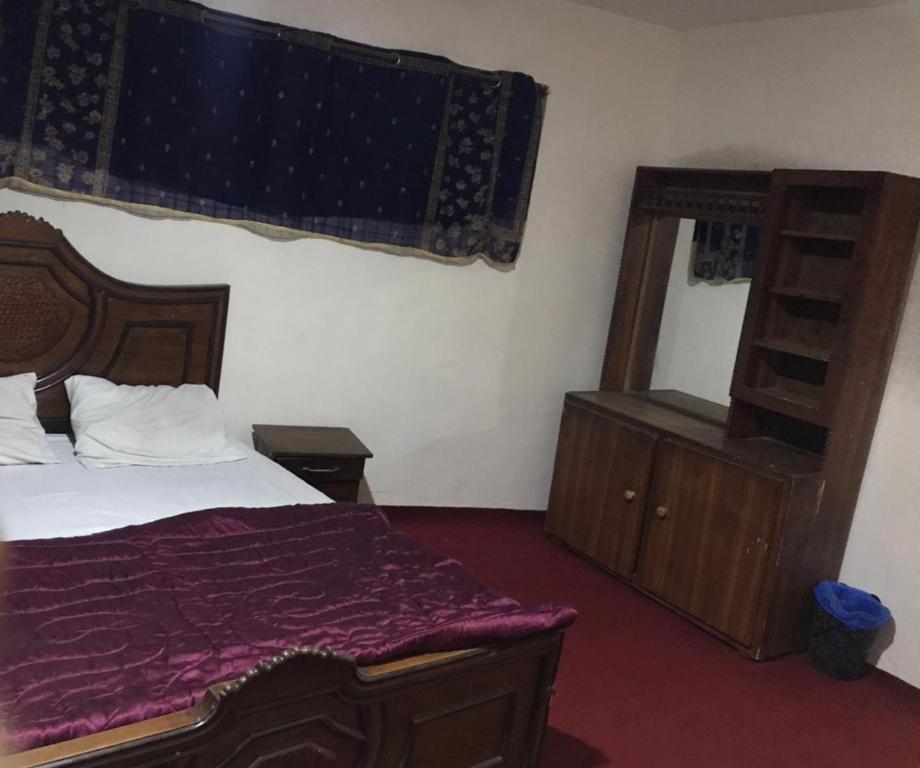 Postel nebo postele na pokoji v ubytování Highlander inn Skardu