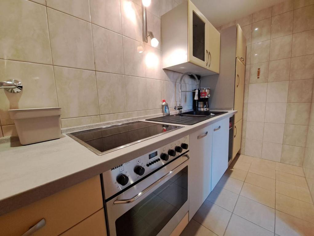 Kuchyň nebo kuchyňský kout v ubytování Mediterran Hotel Juwel