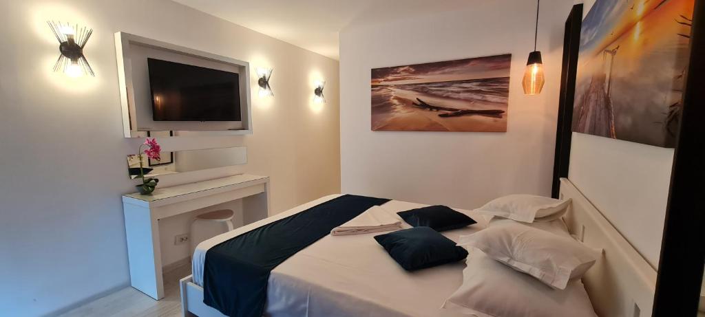 Postel nebo postele na pokoji v ubytování Hotel Sunquest