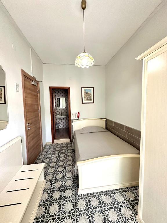 Postel nebo postele na pokoji v ubytování Hotel Europa