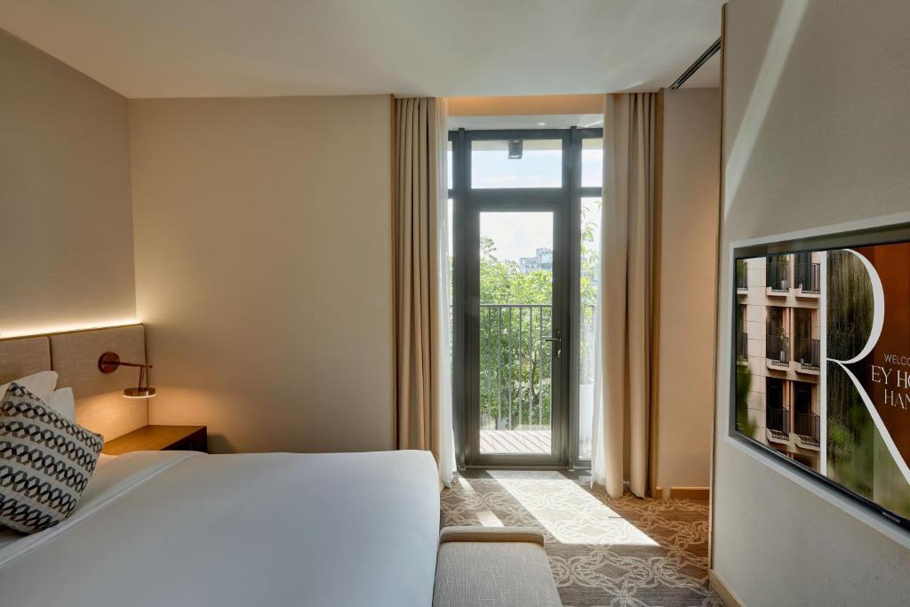 Postel nebo postele na pokoji v ubytování REY Hotel Hanoi