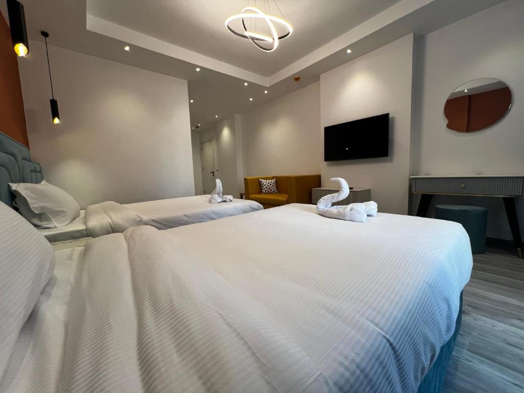 Postel nebo postele na pokoji v ubytování Onyx Pyramids Boutique Hotel