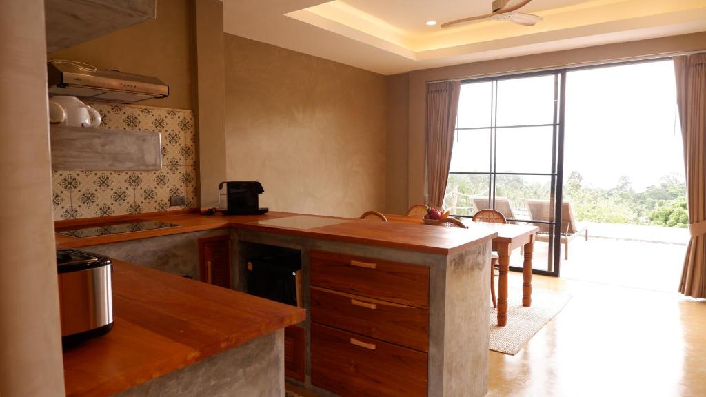 Kuchyň nebo kuchyňský kout v ubytování Villa La Quartz Seaview 2BR
