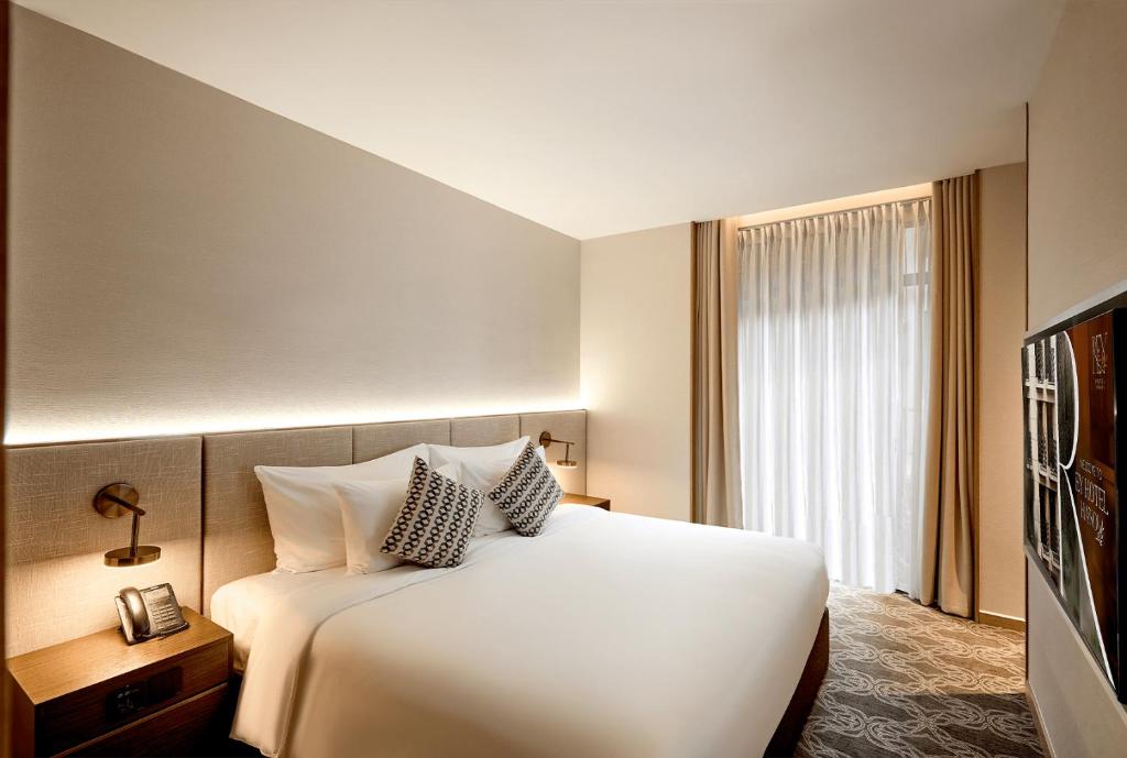 Postel nebo postele na pokoji v ubytování REY Hotel Hanoi