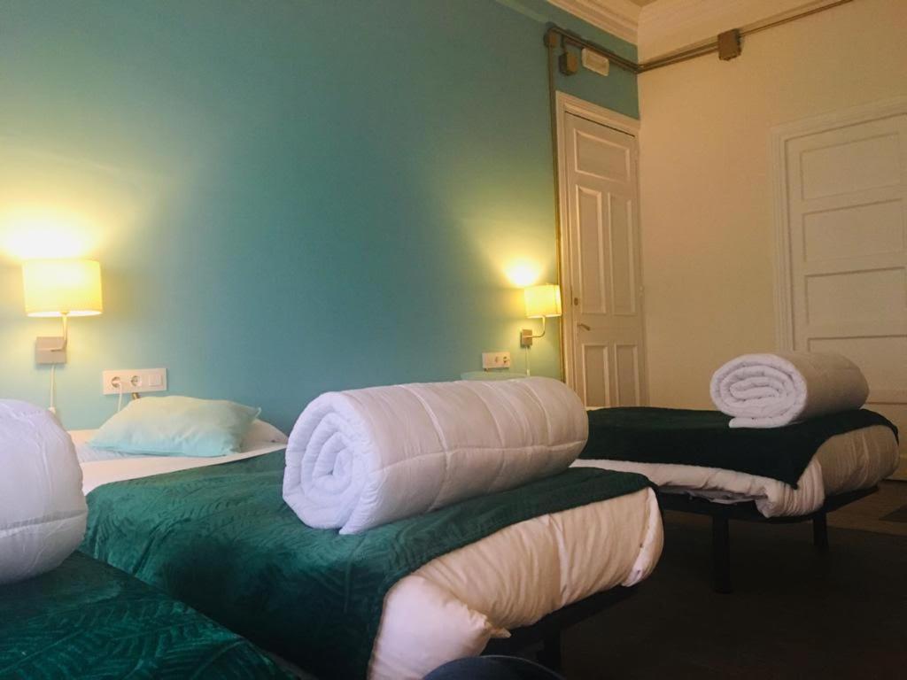 Postel nebo postele na pokoji v ubytování Zentric Hostel