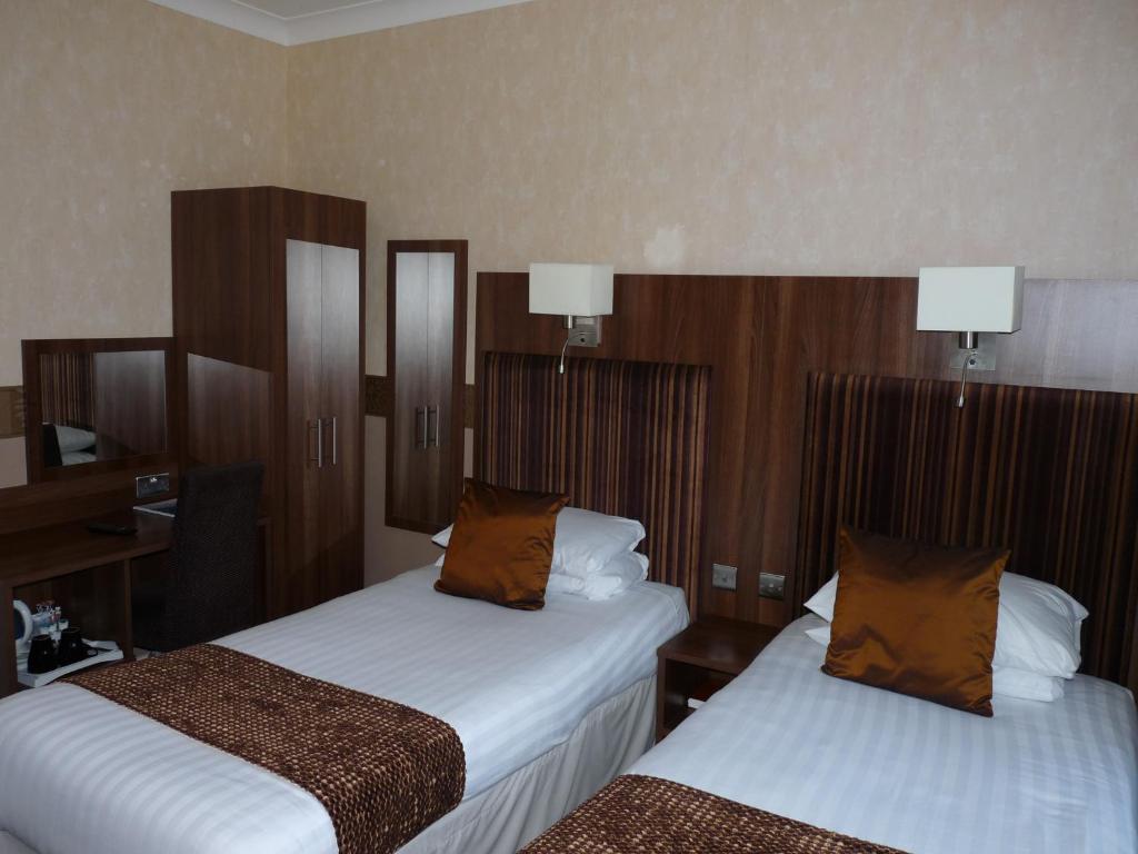 Postel nebo postele na pokoji v ubytování The Park Hotel