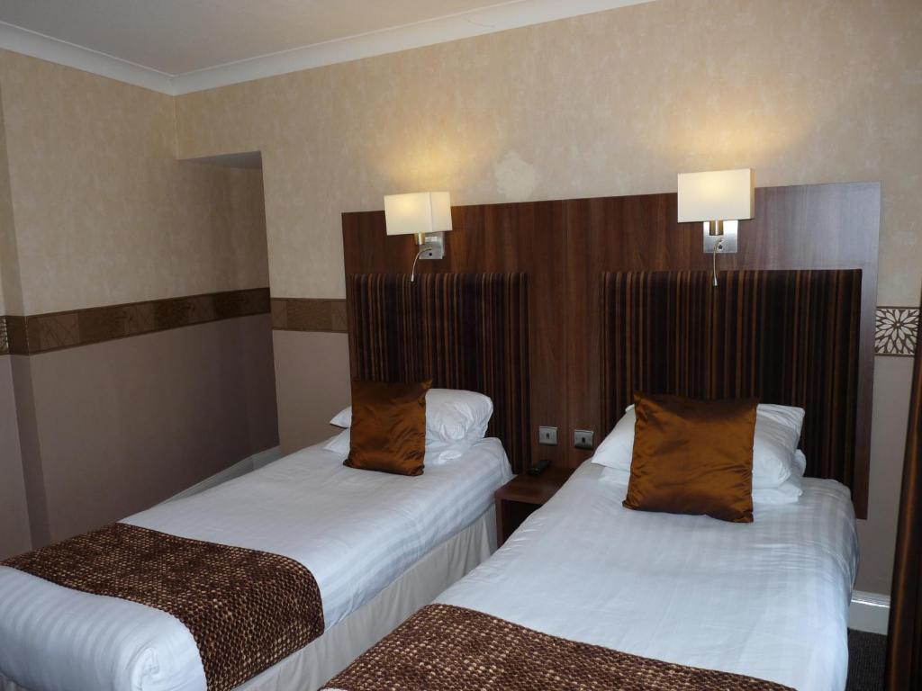 Postel nebo postele na pokoji v ubytování The Park Hotel