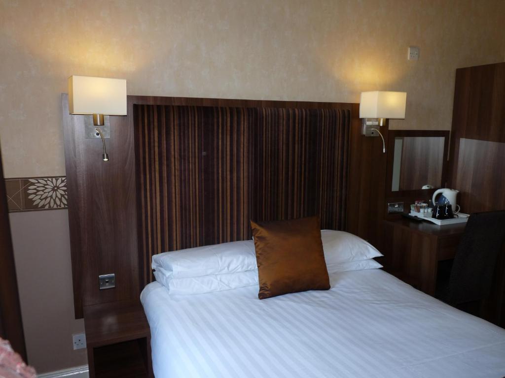 Postel nebo postele na pokoji v ubytování The Park Hotel