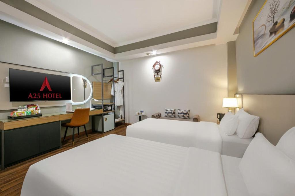 Postel nebo postele na pokoji v ubytování A25 Hotel - 12 Phố Huế