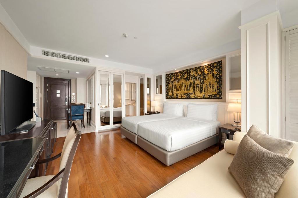 Postel nebo postele na pokoji v ubytování Grande Centre Point Hotel Ratchadamri Bangkok