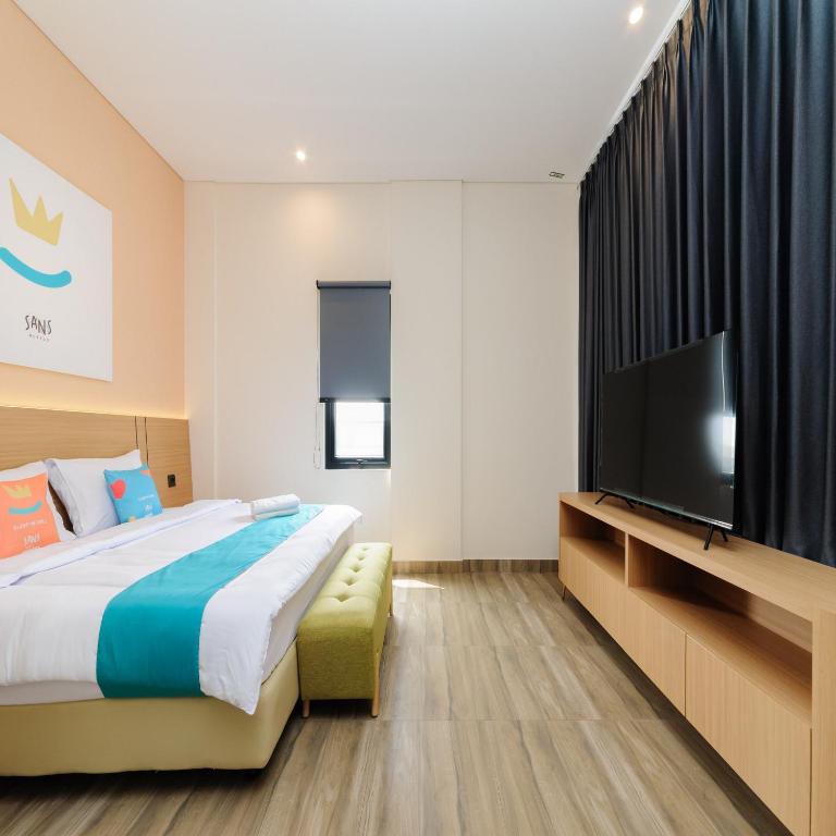 Postel nebo postele na pokoji v ubytování Sans Hotel Kedoya
