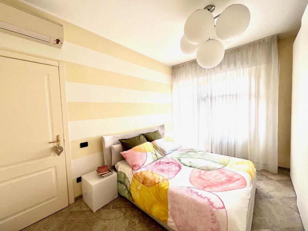 a bedroom with a bed and a ceiling fan at I piedi nell'acqua in Finale Ligure