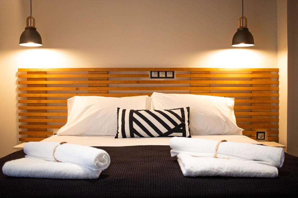 A bed or beds in a room at Elysian Studios