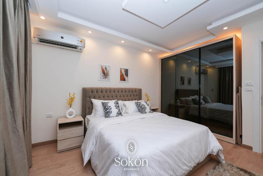 Postel nebo postele na pokoji v ubytování Sokón Residence ,Cairo ,New Cairo,Madinaty,B6,U02