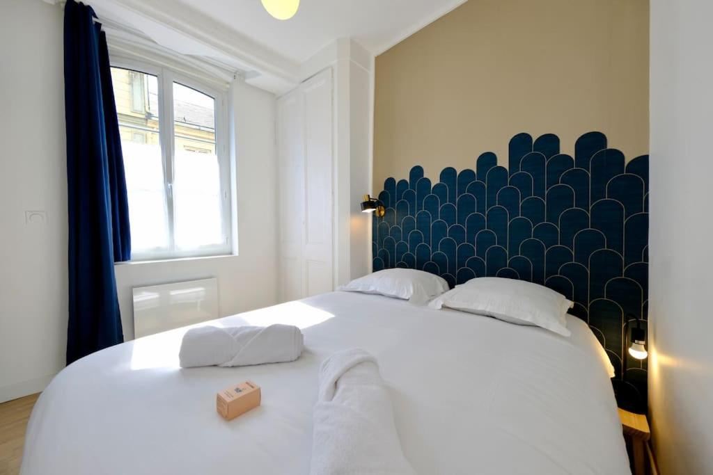 Ένα ή περισσότερα κρεβάτια σε δωμάτιο στο Rouen centre - Les Capucins