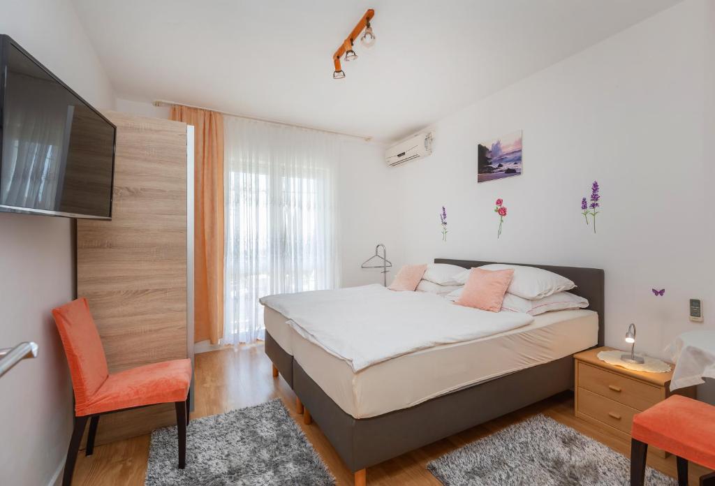 Кровать или кровати в номере Apartmani Galić 2
