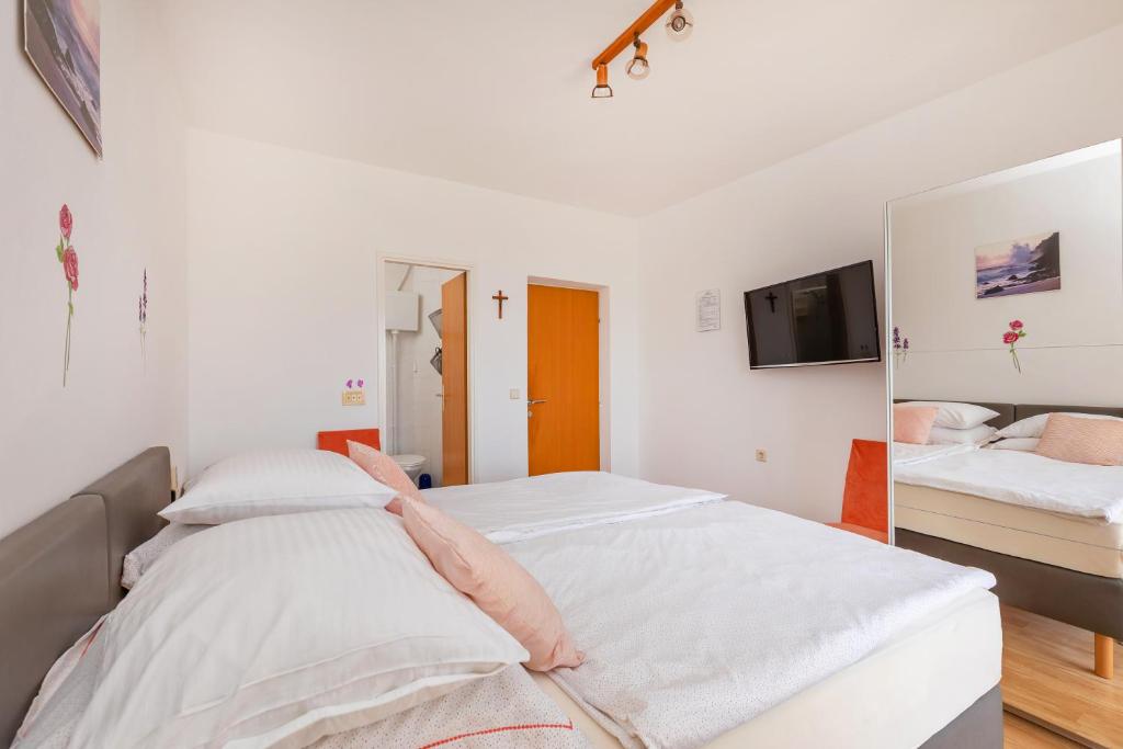 Кровать или кровати в номере Apartmani Galić 2