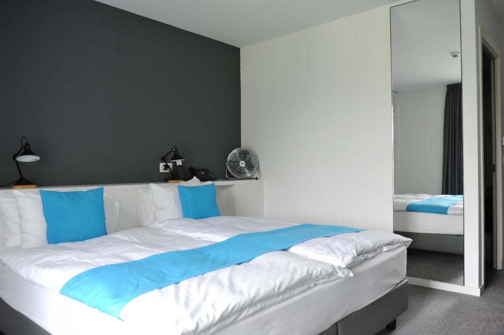 Voodi või voodid majutusasutuse Hôtel de la Source toas