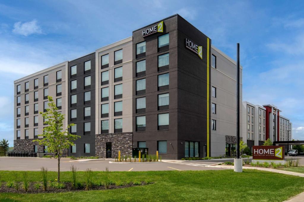 a large building with a sign on the side of it at Home2 Suites By Hilton Thunder Bay in Thunder Bay