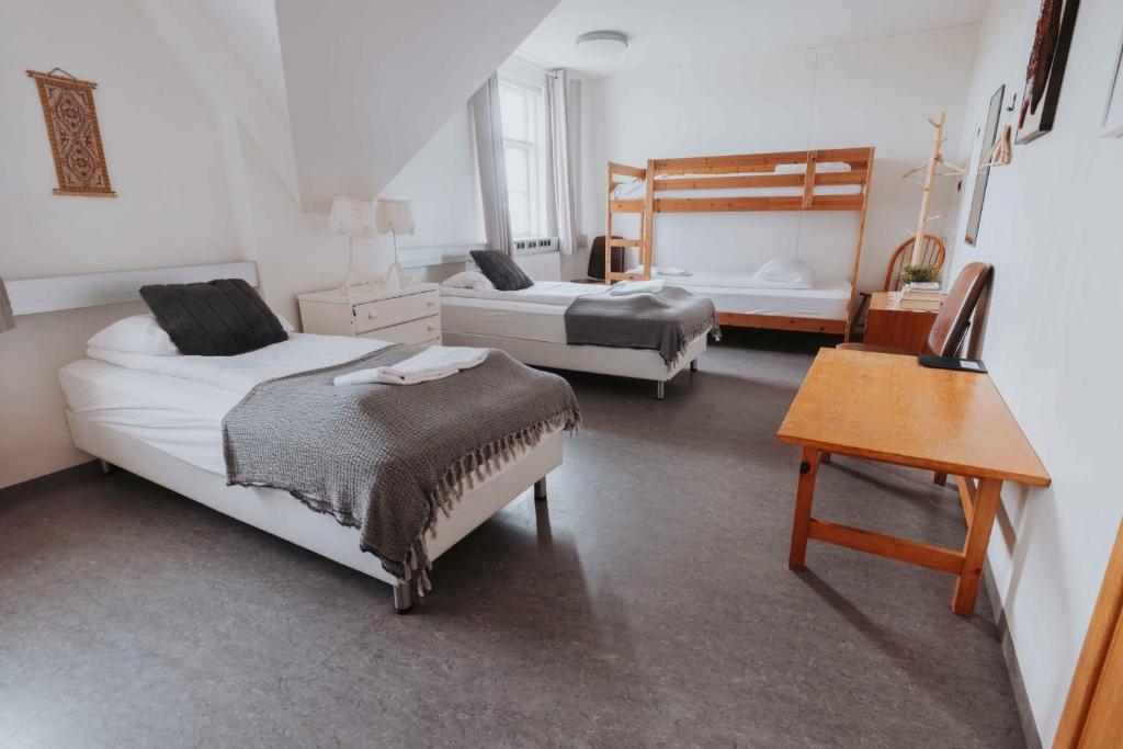 Voodi või voodid majutusasutuse Héradsskólinn Historic Guesthouse toas