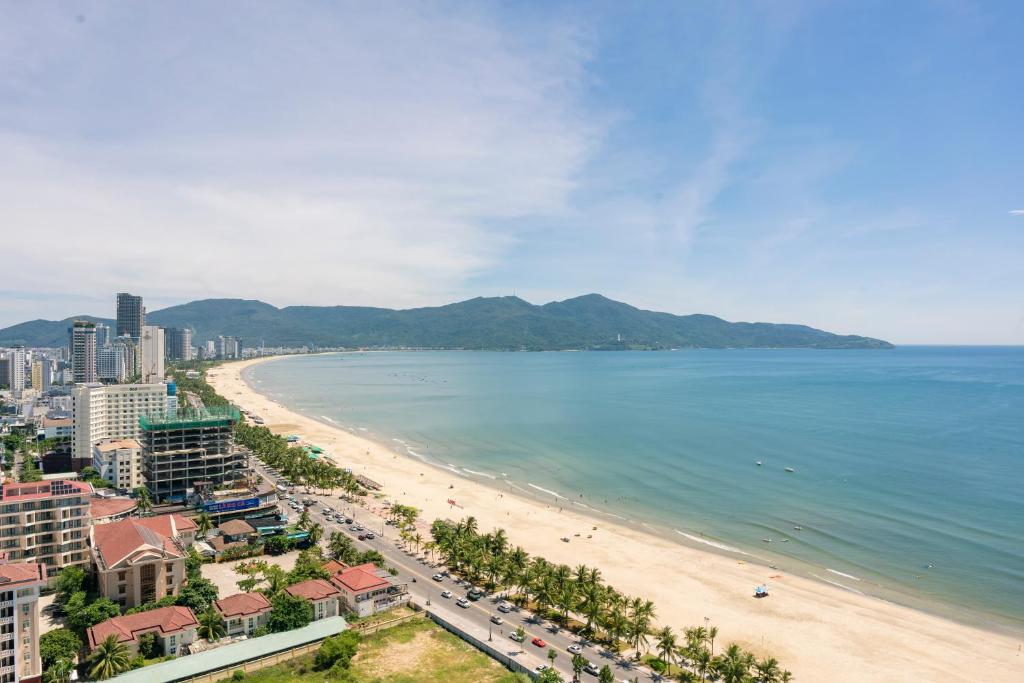 a view of a beach and the ocean at Sóng Apartment - Seaside retreat in Da Nang