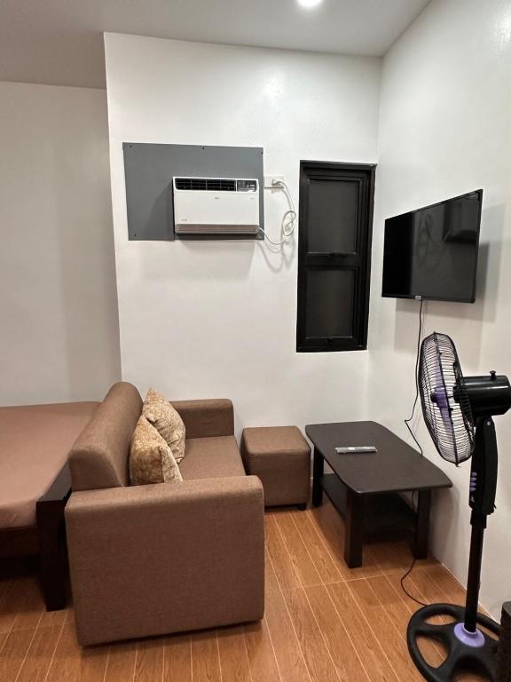 TV a/nebo společenská místnost v ubytování RJC Building