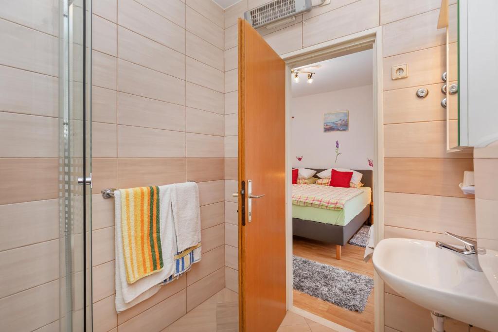 Кровать или кровати в номере Apartmani Galić 2