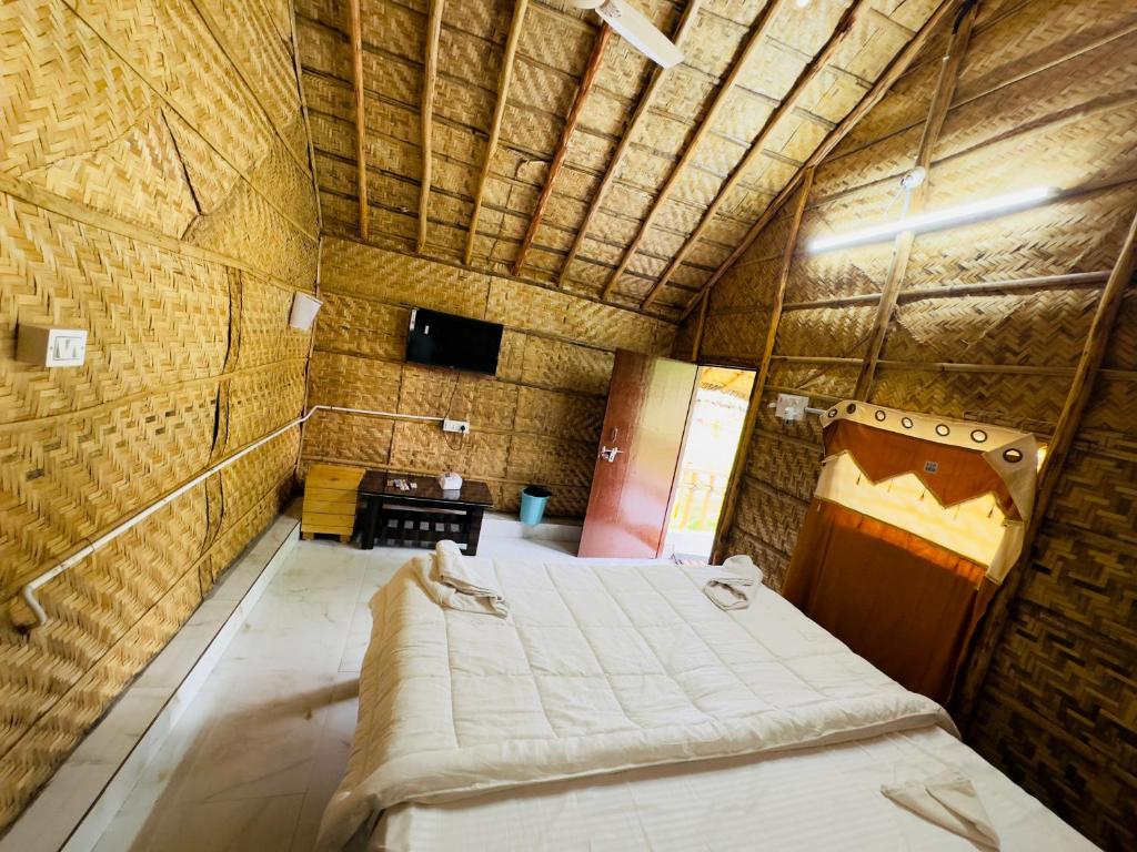 Katil atau katil-katil dalam bilik di Tamarind Tree Way Side Amenities