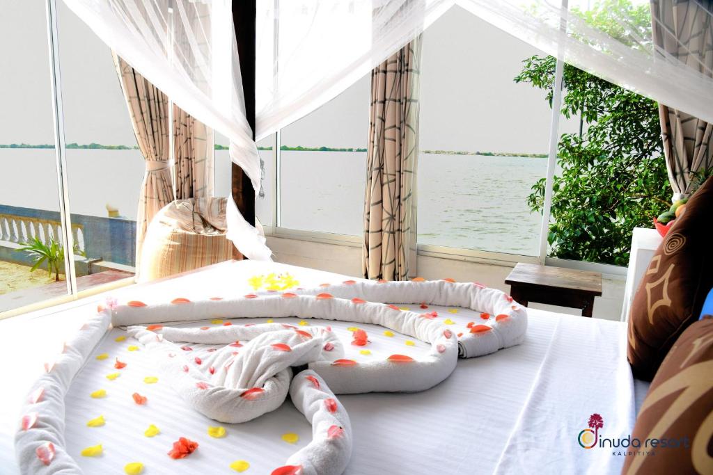 Postel nebo postele na pokoji v ubytování Dinuda Resort