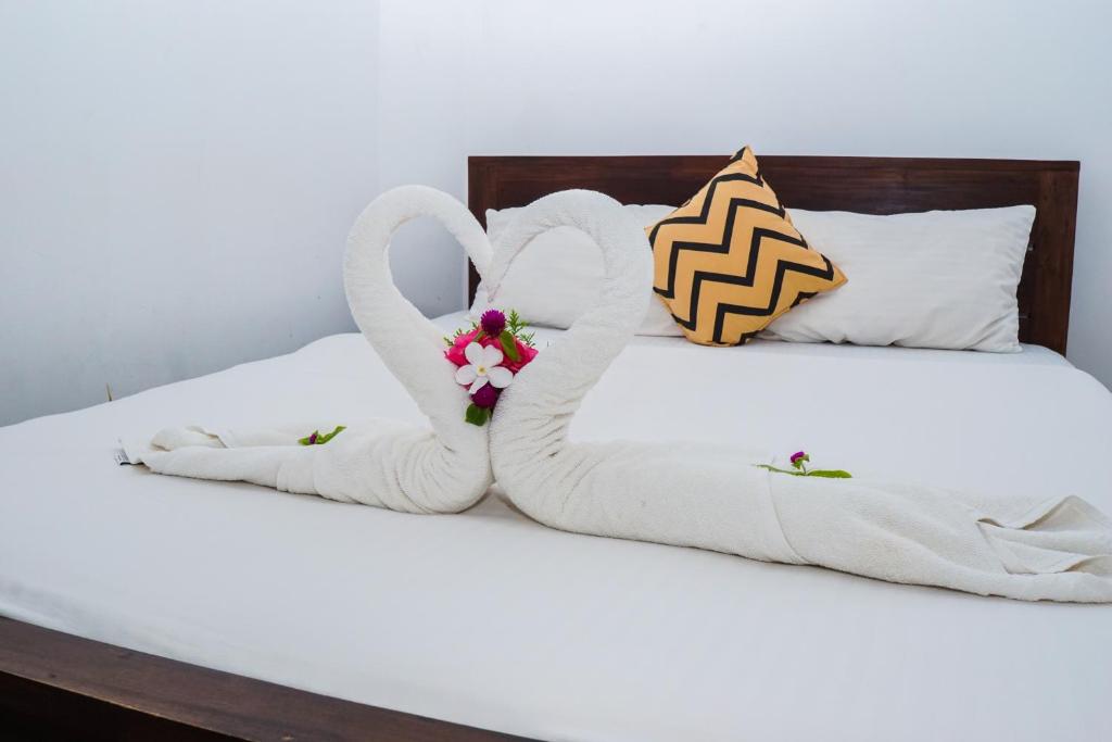 Postel nebo postele na pokoji v ubytování Dinuda Resort